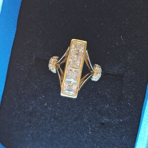 Super flashy CZ ring size 6 1/4. Stamped 925 with a gold wash. See all pics for